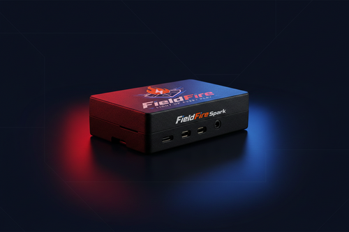 FieldFire Spark portable game-day controller with USB, HDMI, and audio connections in an orange-and-blue studio scene.