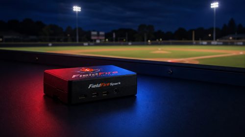 FieldFire Spark controller on a protected baseball operations counter at blue hour.